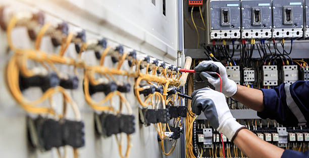Professional Electrician technician working in Higginsville, MO